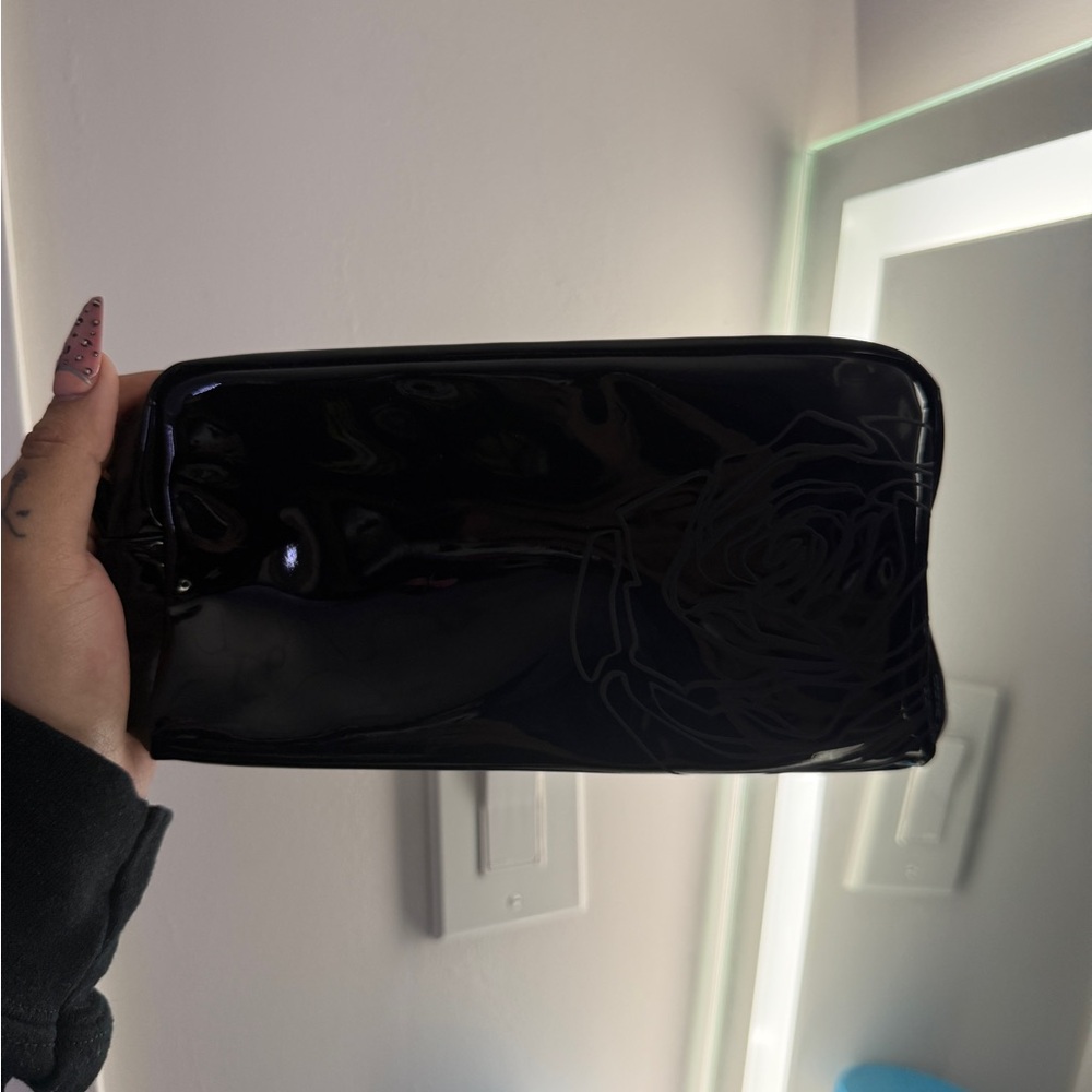 Glossy Black Patent Cosmetic Pouch with Subtle Rose Detail